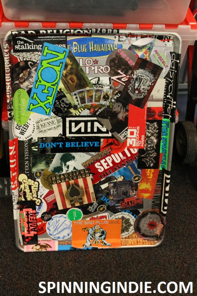 Tray plastered with stickers at college radio station WLOY