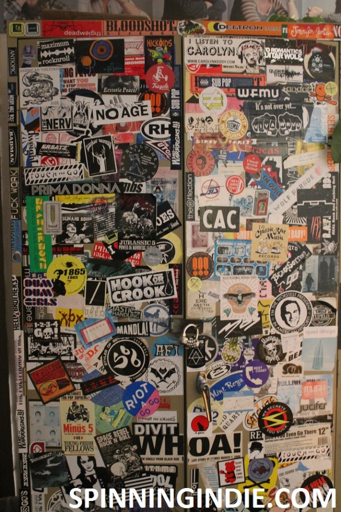 sticker-covered cabinet at San Francisco Community Radio