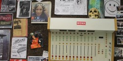 studio wall at college radio station WVAU with board and skull