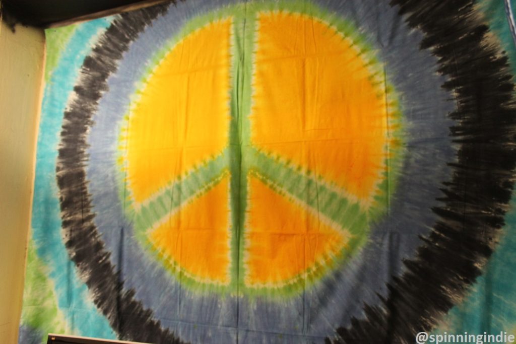 Peace sign tapestry in KPSQ-LP's future studio. Photo: J. Waits