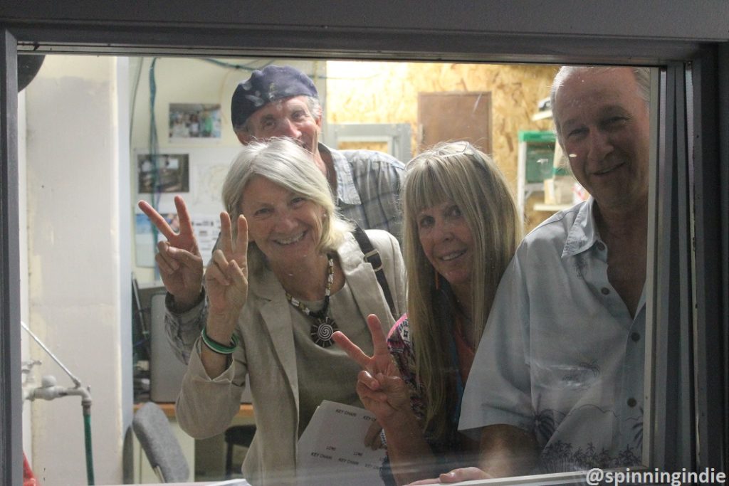 Moshe Newmark, Hamsa Newmark, Dawn Newman and Joe Newman peek out of the future KPSQ-LP studio window. Photo: J. Waits