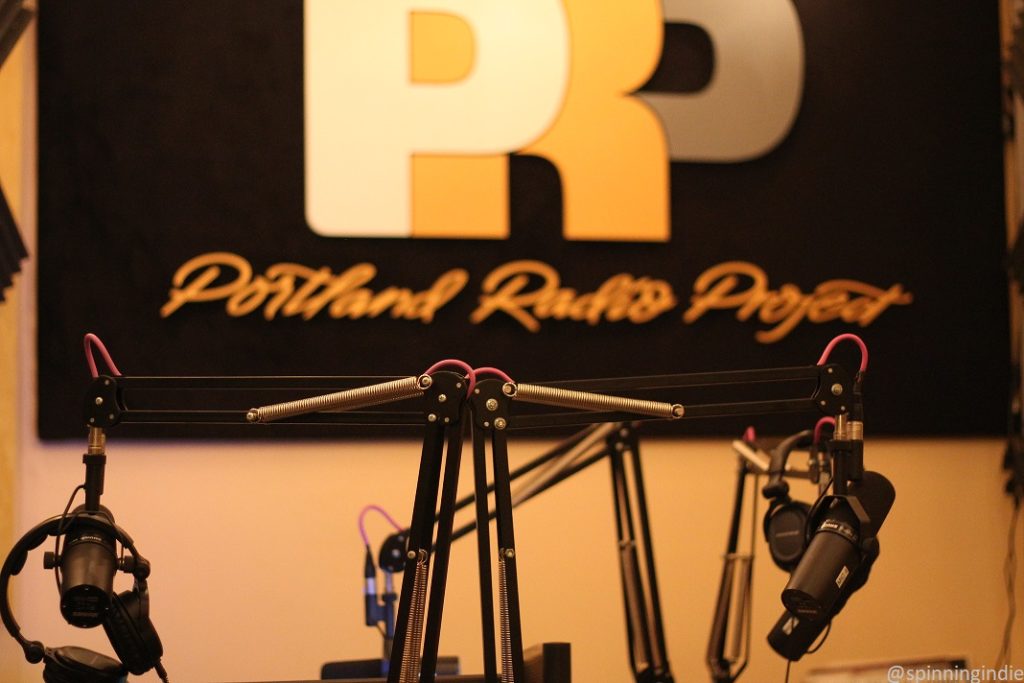 Wall sign and microphones in on-air studio at Portland Radio Project. Photo: J. Waits