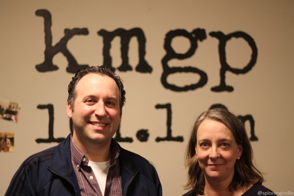 Eric Zappa and Julianna Ross in front of KMGP 101.1 FM sign. Photo: J. Waits/Radio Survivor