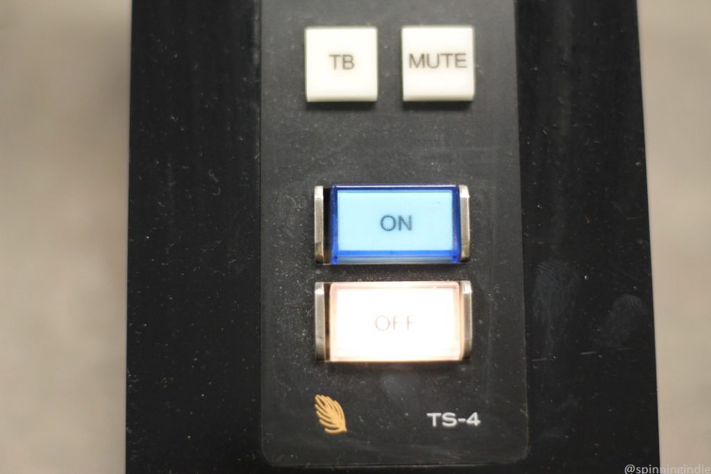 Audio equipment in SDS radio studio. Buttons labeled "TB," "MUTE," "ON" (which shaded blue) and "OFF." Photo: J. Waits/Radio Survivor