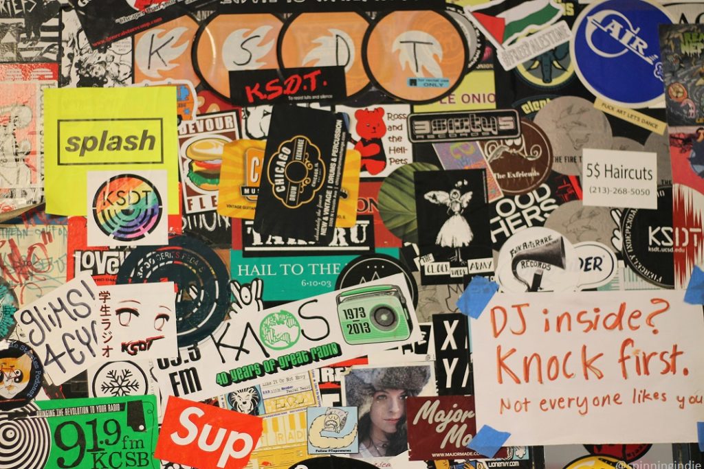 Sticker-covered door at college radio station KSDT. Photo: J. Waits/Radio Survivor