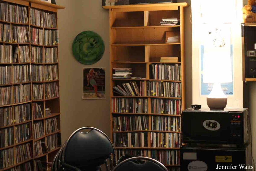 College radio station WCDB's Rock Library. Shown: Shelves of CDs, lamp, flyers on the walls. Photo: J. Waits