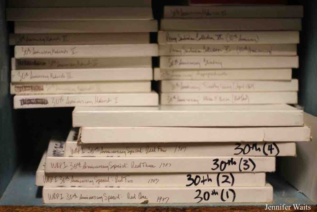 Photo of cardboard boxes of reel-to-reel tapes labeled "WRPI 30th anniversary special...1987." Photo: J. Waits