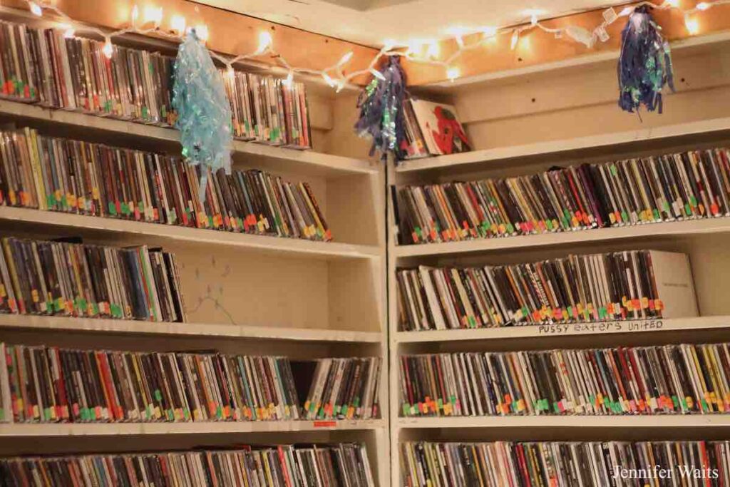 Photo of shelves of CDs at college radio station WXBC. Photo: J. Waits