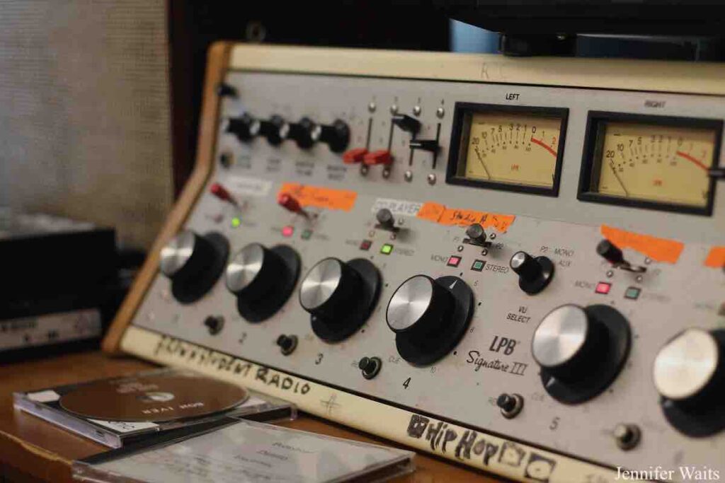 Photo of vintage radio console at college radio station BSR. Console has large round knobs and is labeled LPB Signature III. VU meters can be seen on the top of the equipment. Photo: J. Waits