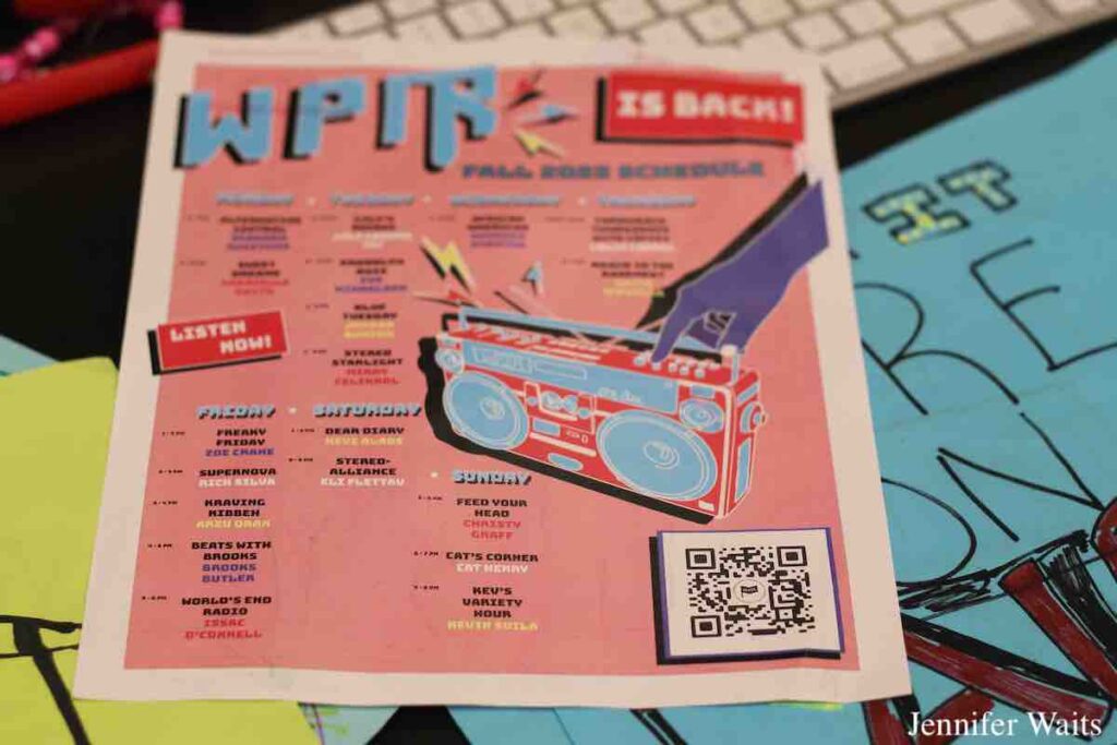 WPIR flyer at the Pratt Institute college radio station in March, 2023. Flyer reads: "WPIR IS BACK!" and has a schedule, image of a boombox, and a QR code on it. Photo: J. Waits