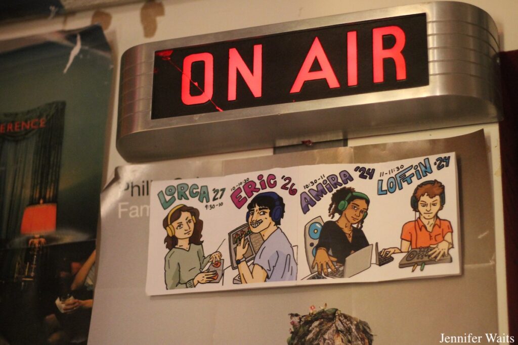 Vintage "On-Air" sign at Bowdoin College radio station WBOR. Below the sign are drawings of DJs. Photo: J. Waits