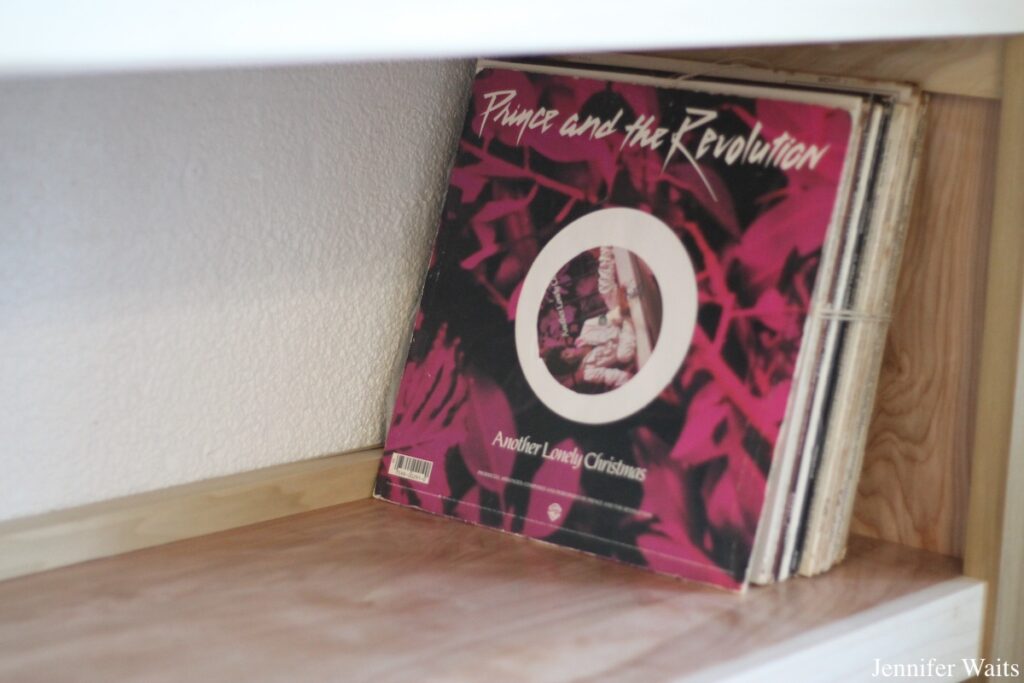 Group of LPs on a wooden shelf in college radio station WBOR's future home. Record in the front is Prince and the Revolution's "Another Lonely Christmas." Photo: J. Waits