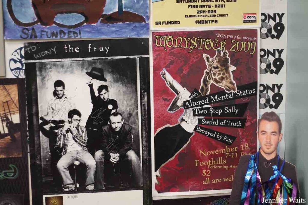 Photo of posters on the wall at college radio station WONY-FM. Included is a poster of The Fray and a poster from WONYSTOCK 2009. Photo: J. Waits