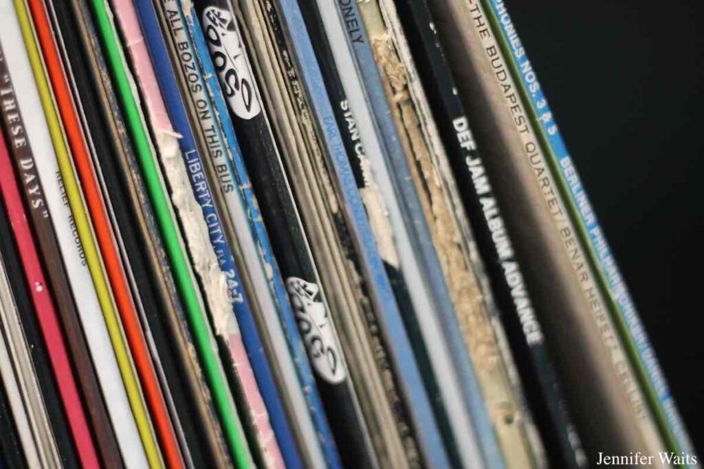 Photo of the spines of vinyl records  on a shelf at college radio station WONY. Photo: J. Waits