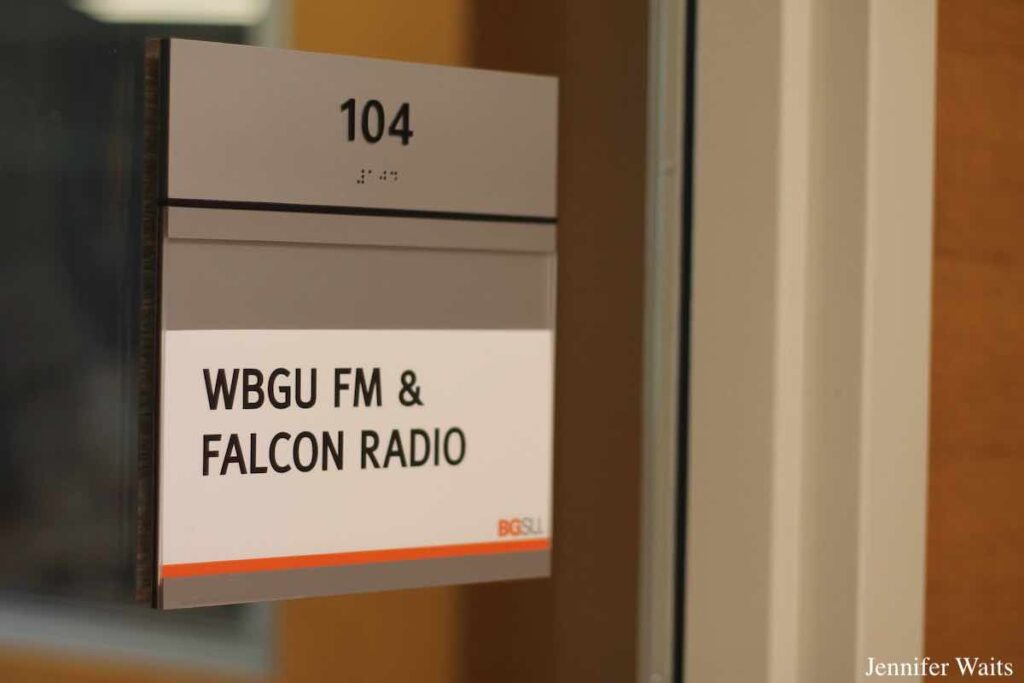 Photo of sign that reads "WBGU FM and Falcon Radio" on a glass window. Photo: J. Waits