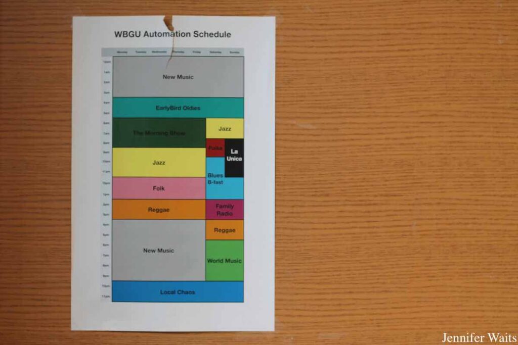 Photo of printout of WBGU automation schedule. Schedule shows programming blocks, including new music, earlybird oldies, jazz, folk, reggae, family radio, and more. Photo: J. Waits