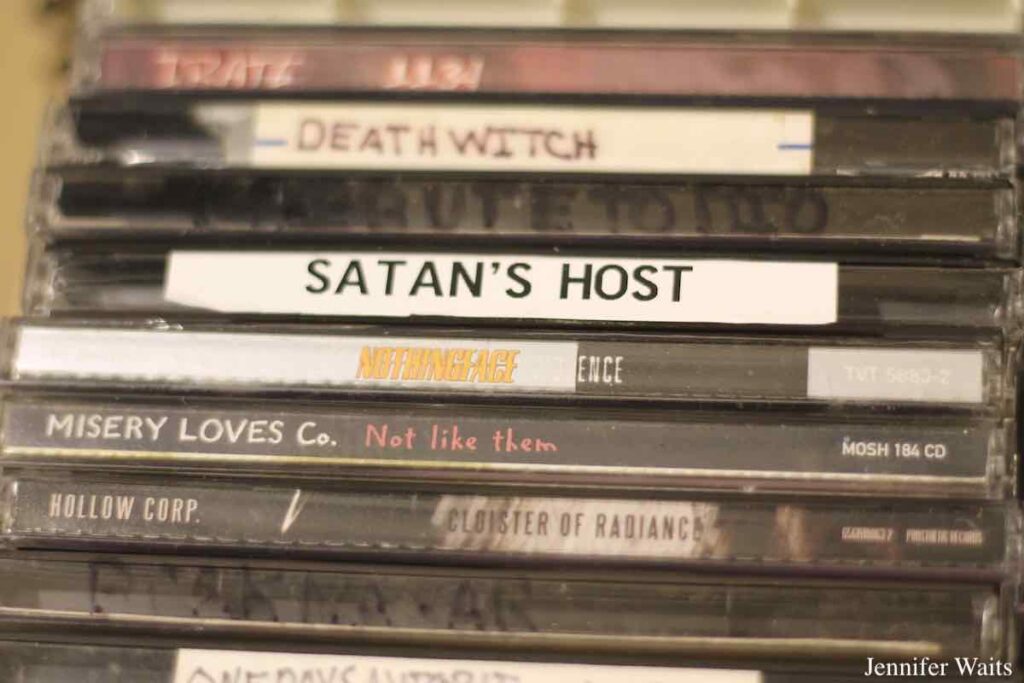 Photo of stack of CDs at college radio station WBGU-FM. Titles on spines of CD cases include: Death Witch, Satan's Host, Misery Loves Co., and more. Photo: J. Waits