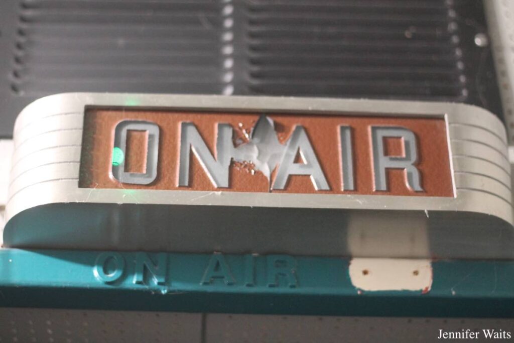 Photo of silver and orange sign that reads "On Air" at college radio station KUCR. Photo: J. Waits